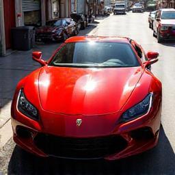 Shiny car being driven away representing completion